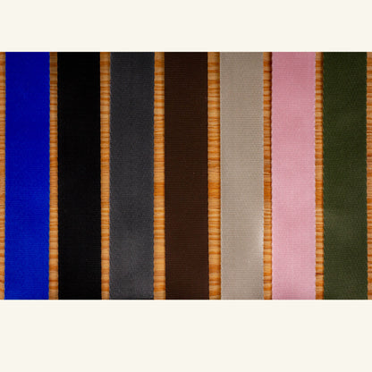 Set of colorful ribbons arranged in a row on a white background